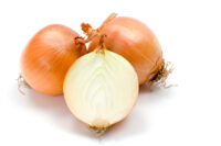 Yellow onions on white background